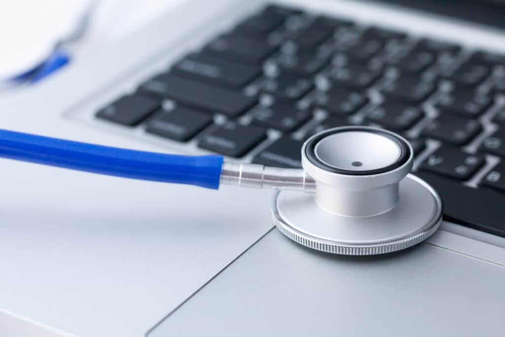 Houston Website Maintenance - Stethoscope on laptop